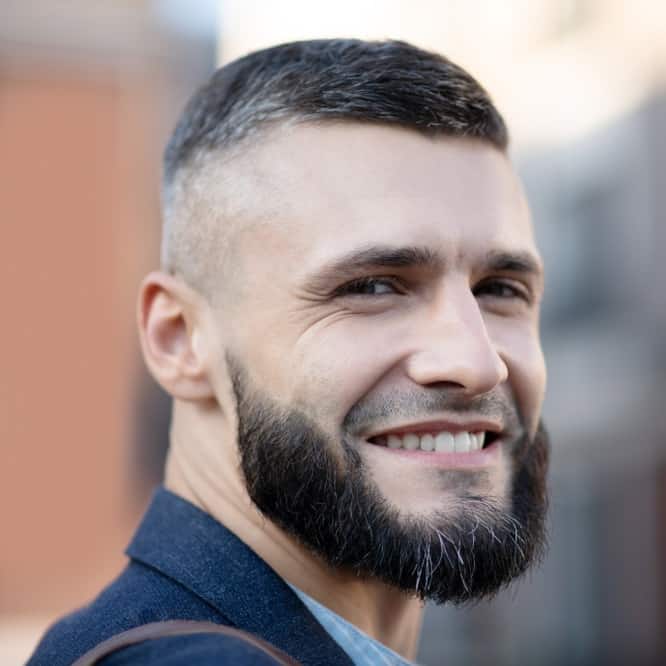 Man With Short Fade Hairstyle With Distinctive Part