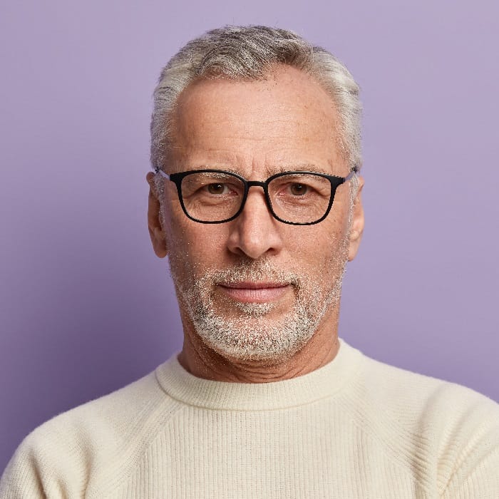 Man With Short Gray Hair, Glasses And Beard