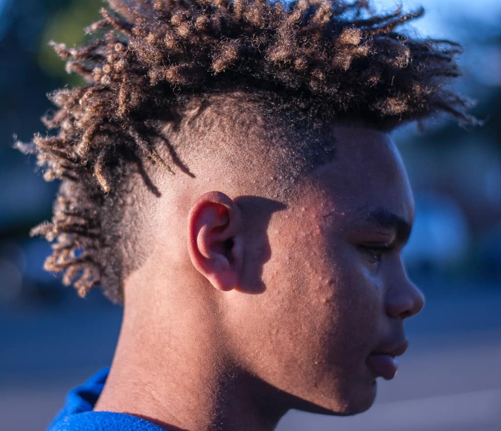 Short Mohawk Dreadlock Hairstyle For Men Featuring An Undercut And Designs