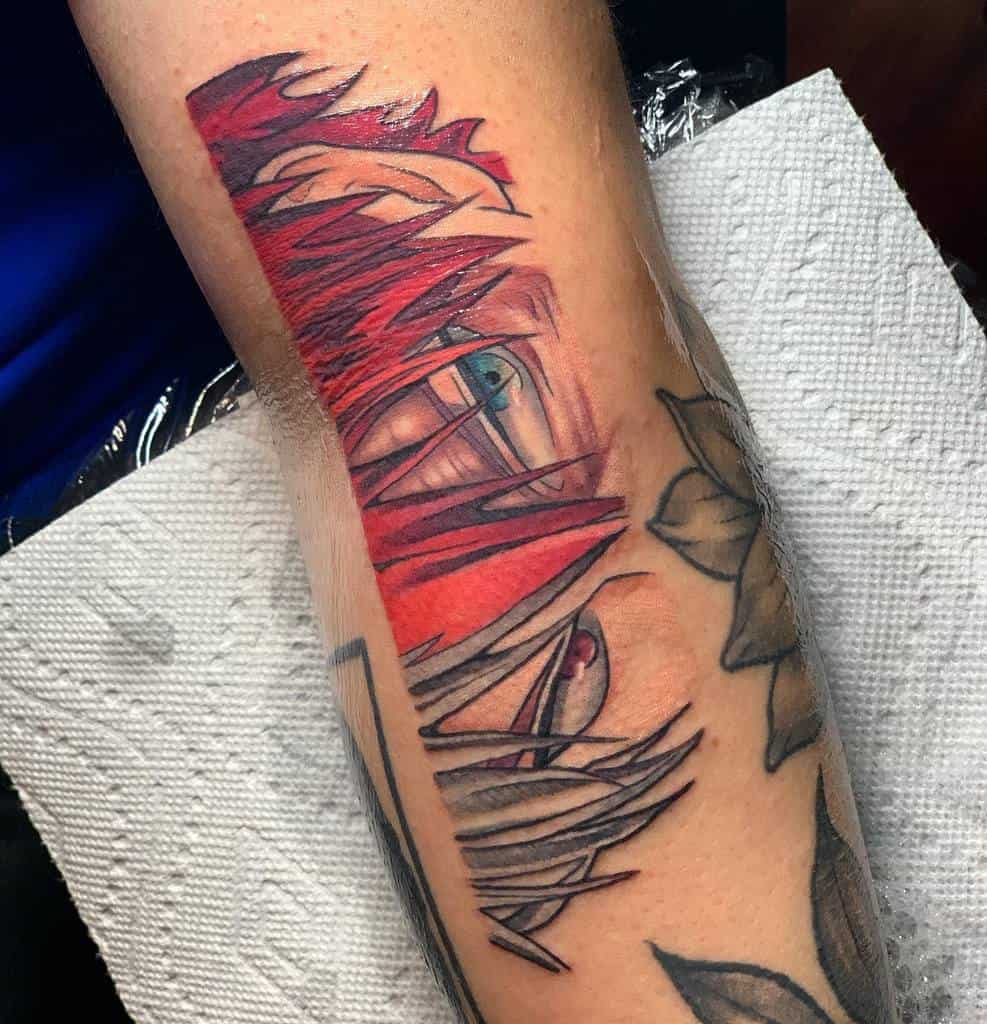 Bold tattoo of Shoto Todoroki from My Hero Academia, featuring an intense close-up of his eyes with dramatic red and black linework