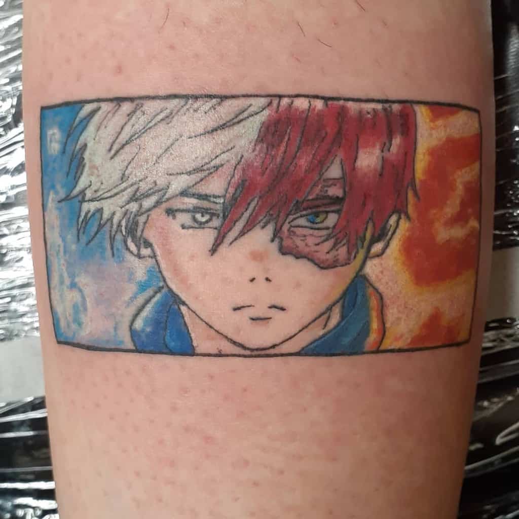 Colorful tattoo of Shoto Todoroki from My Hero Academia, featuring a close-up portrait with fire on one side and ice on the other