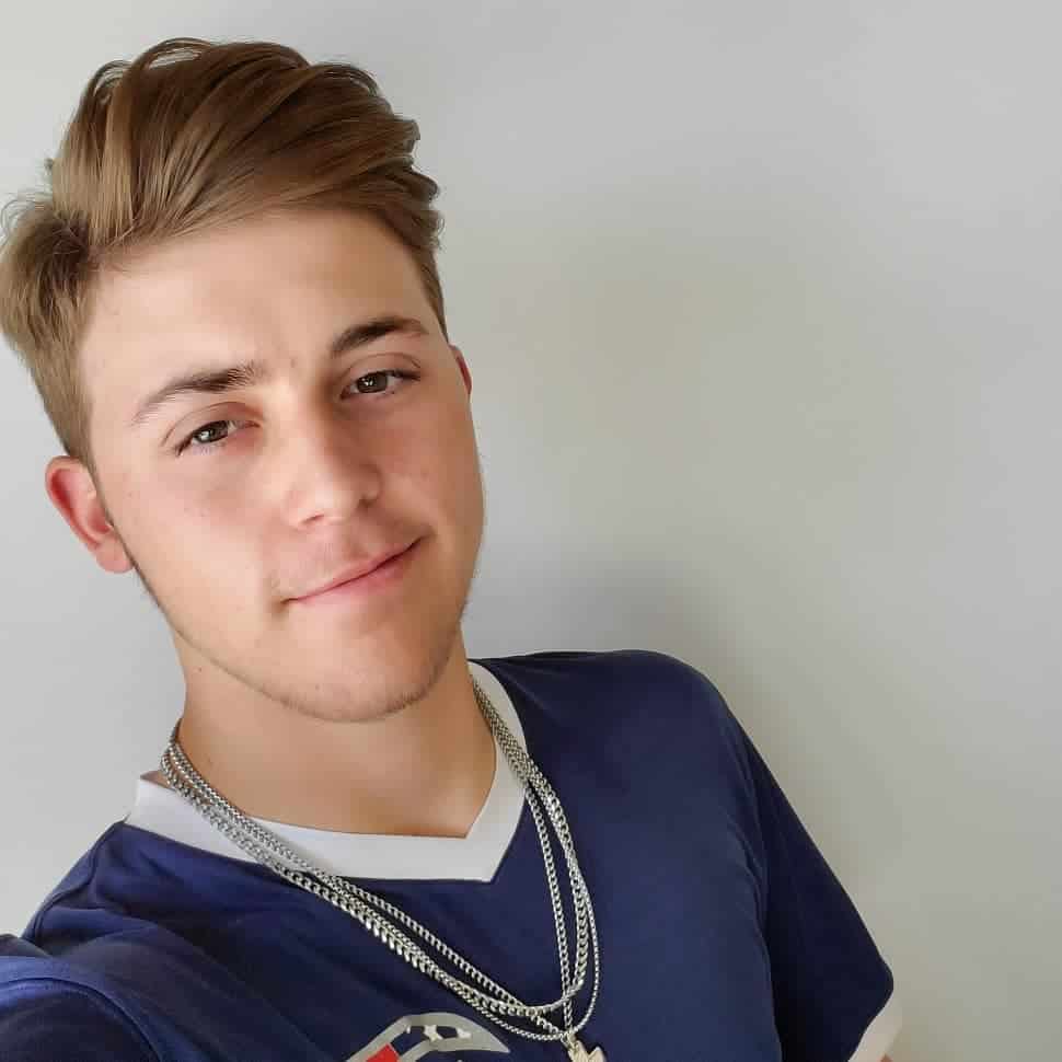 Young man with Bryce Harper inspired side parting hairstyle