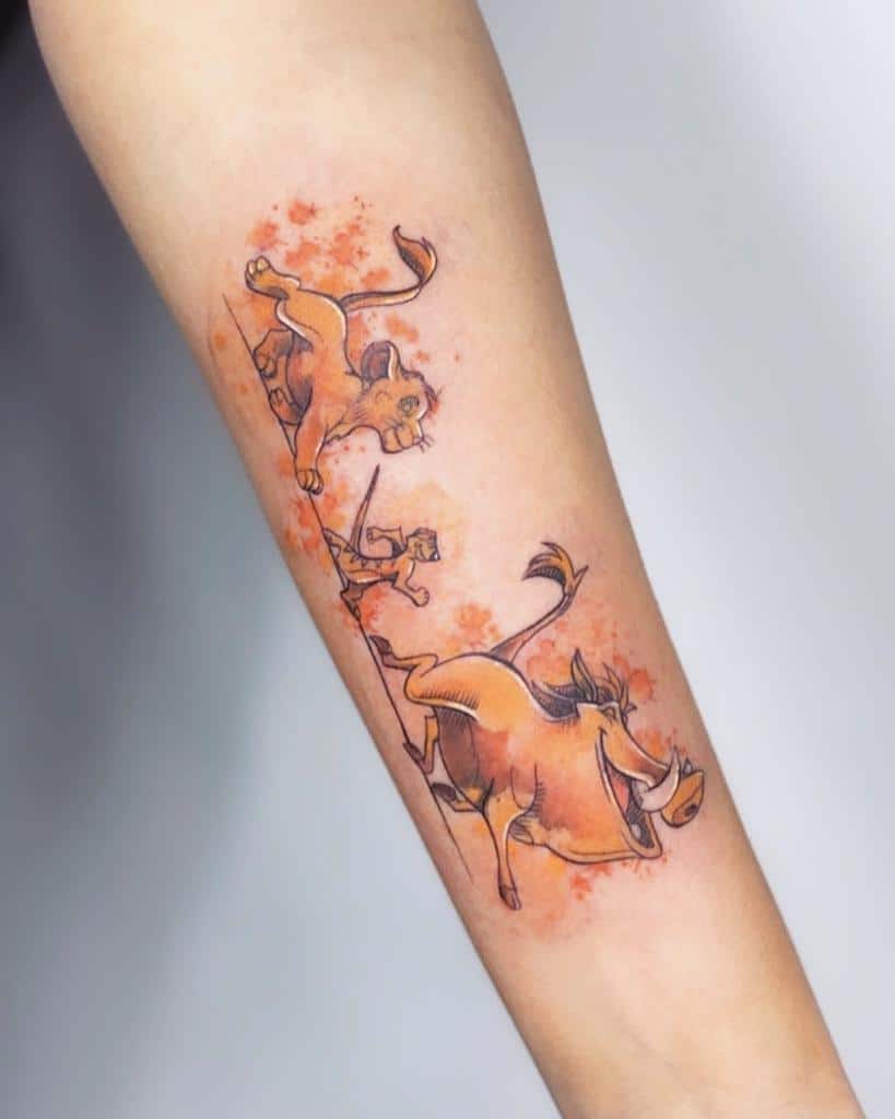 Playful tattoo of Simba, Timon, and Pumbaa in motion with orange watercolor splashes in the background