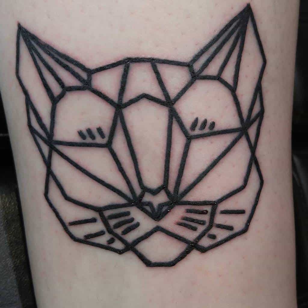 Geometric cat tattoo in black ink on skin