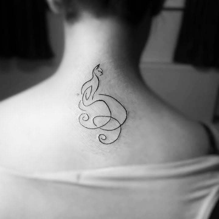 Minimalist cat tattoo on the back of a person's neck