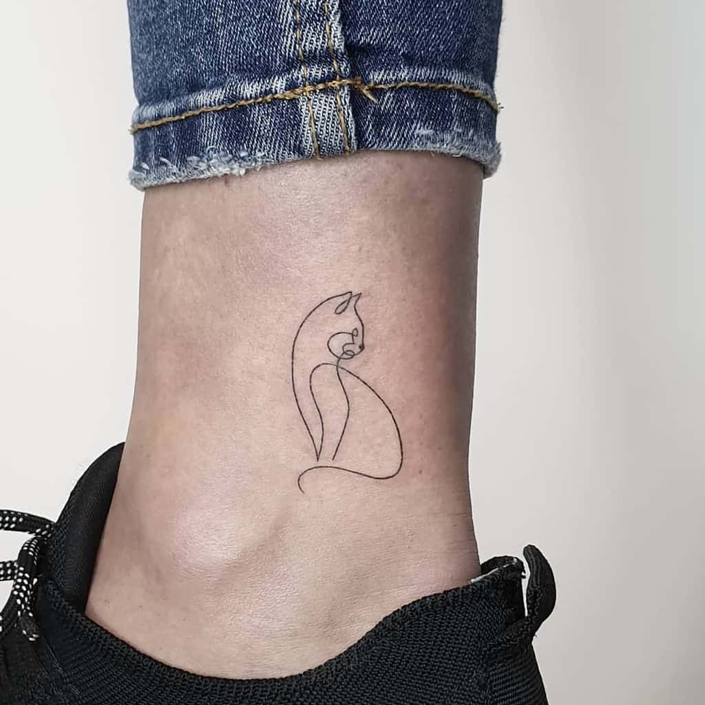 Minimalist cat tattoo on ankle 