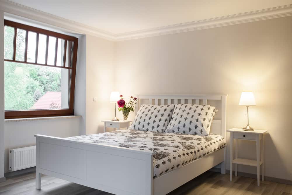 minimalist bedroom with white bed frame