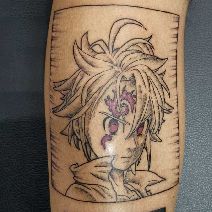 Tattoo of Meliodas from The Seven Deadly Sins, featuring his demon mark and a fierce expression, outlined in a rectangle frame with ink splashes