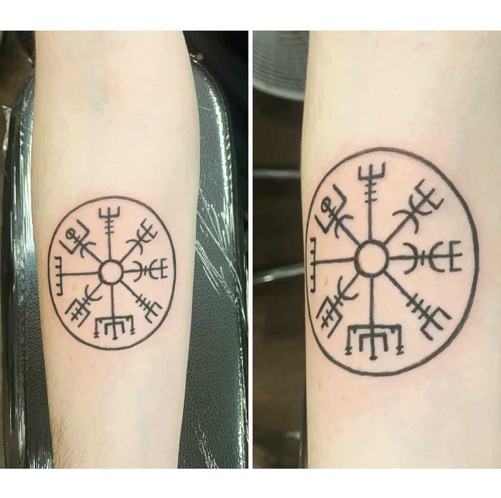 Tattoo of a Vegvísir, a Norse compass, in black ink on forearm
