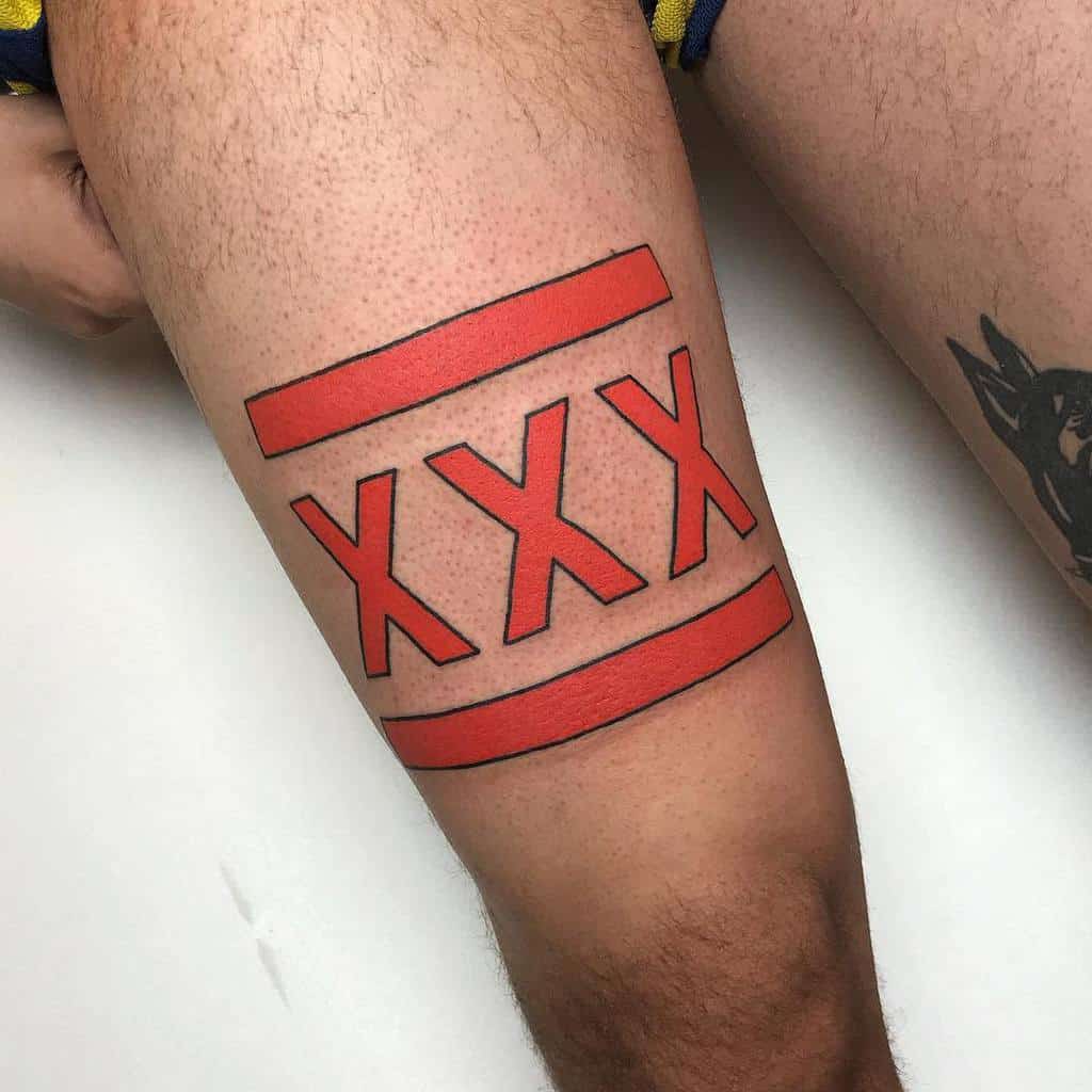 Bold straight edge tattoo featuring three red 'X' symbols framed by thick red bars, creating a strong and striking armband design
