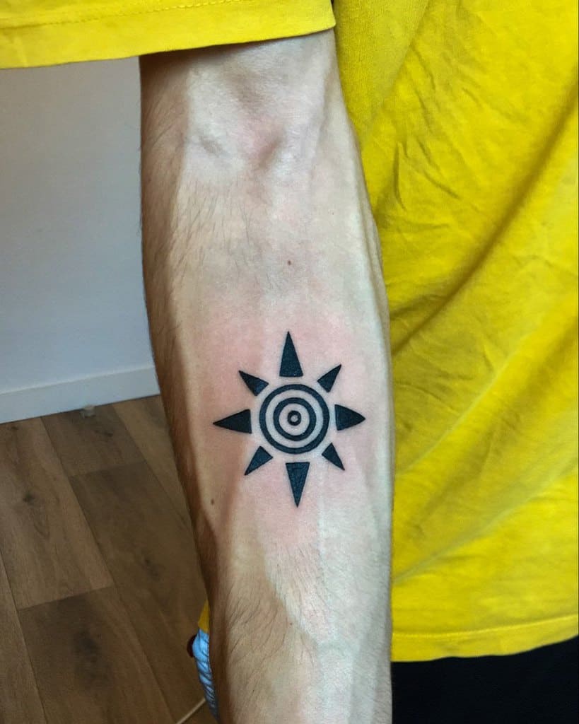 Forearm with black geometric sun tattoo