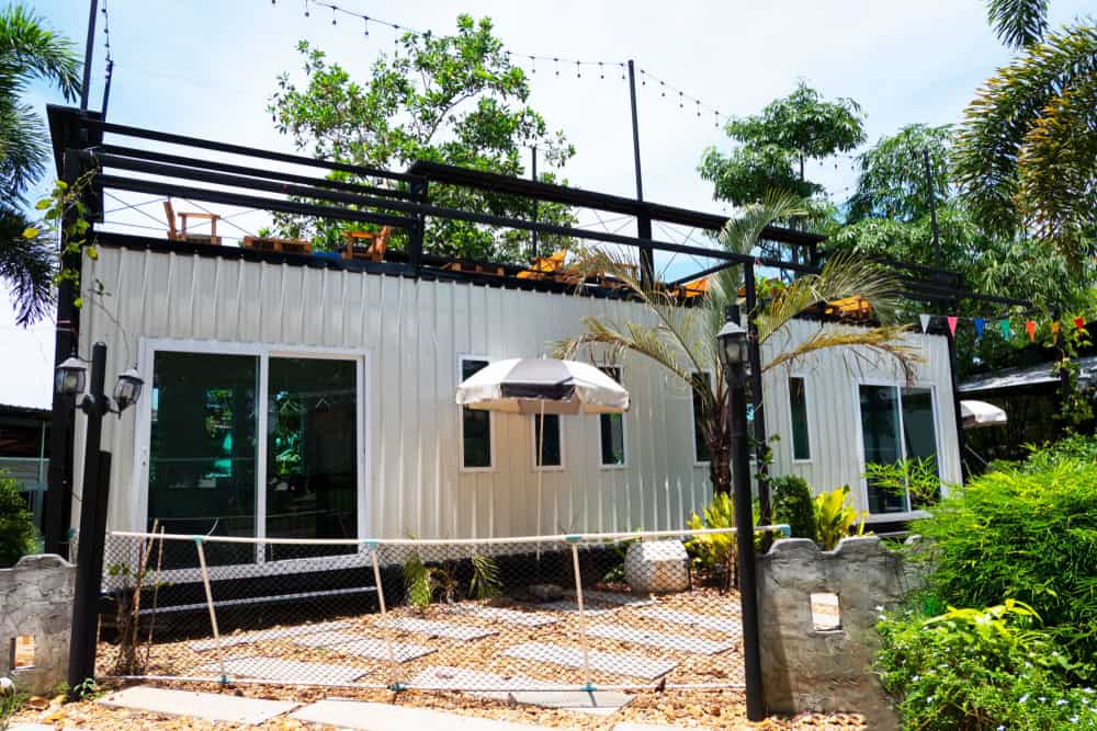 single shipping container home with rooftop