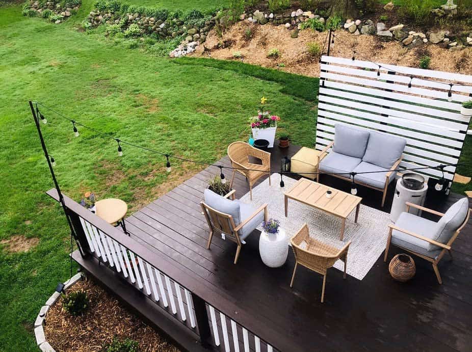 large wood deck wicker furniture hanging lights