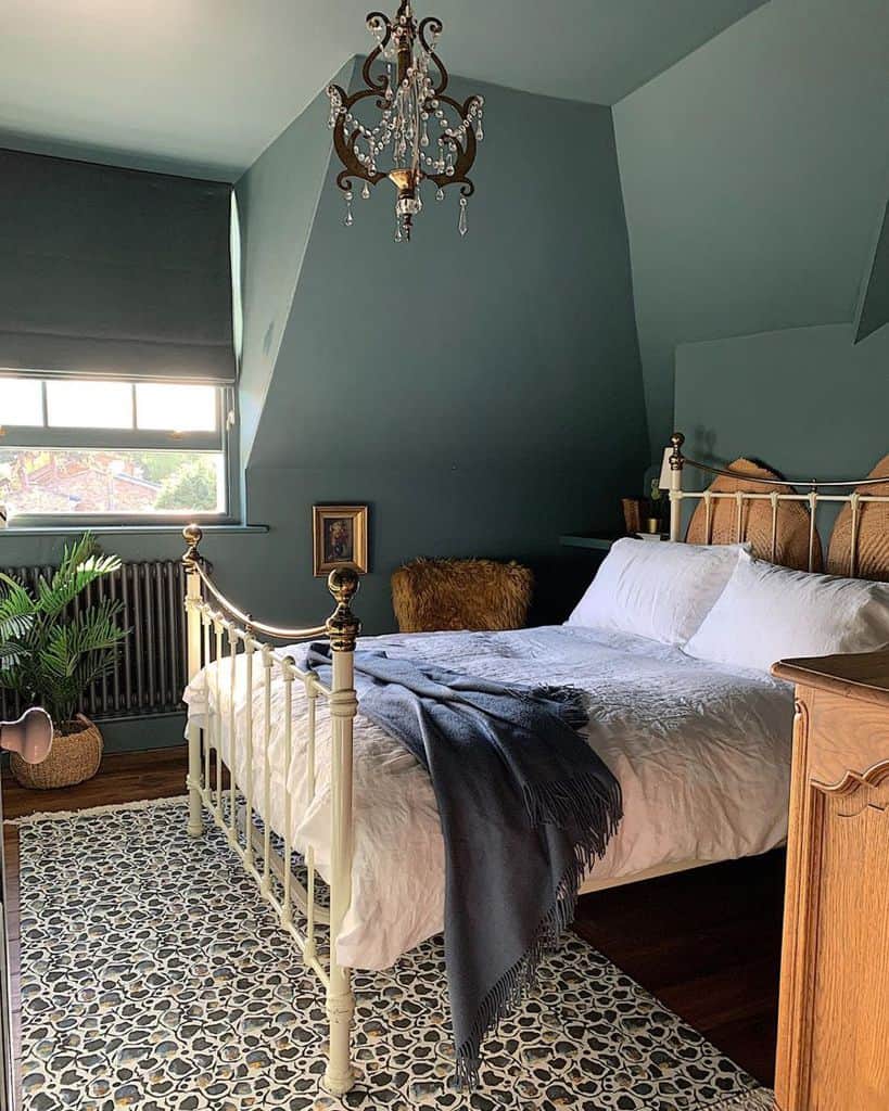 retro green wall attic bedroom with four post bed