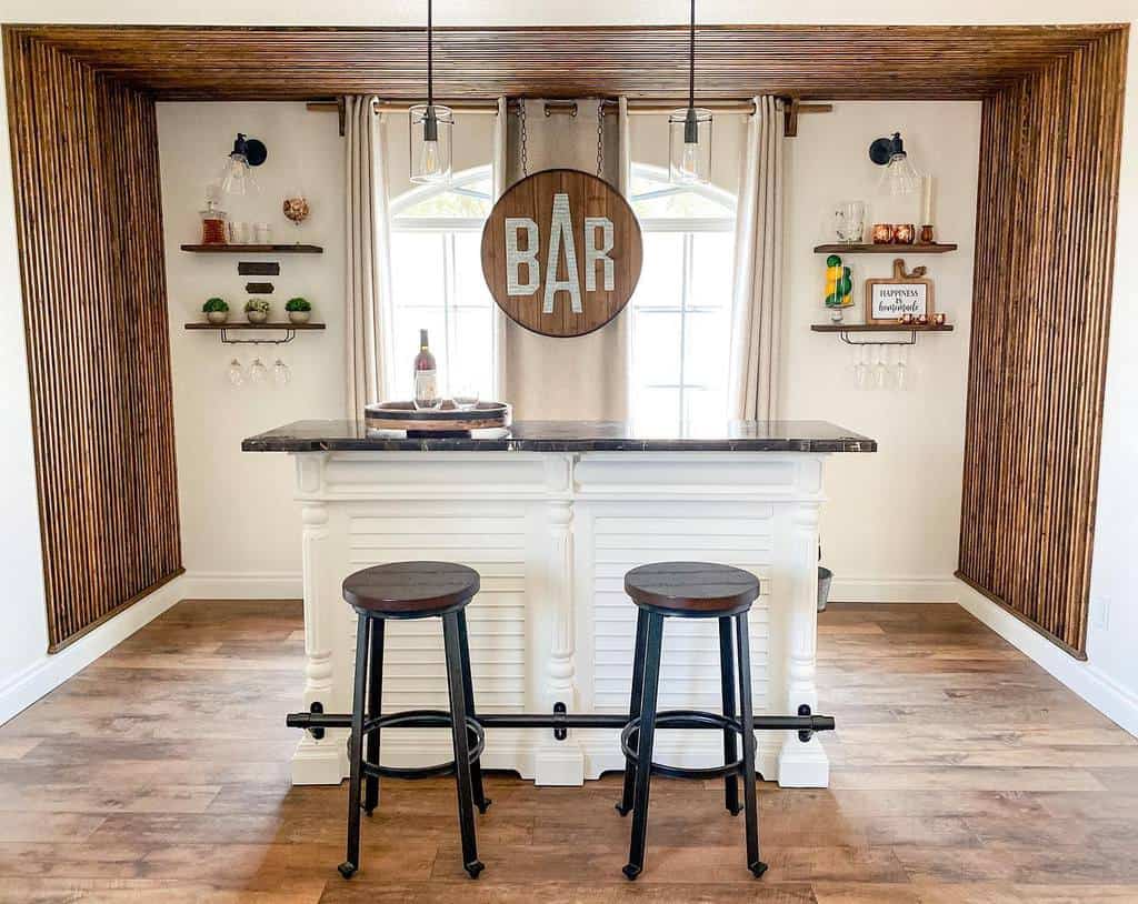 Small basement bar with white cabinetry, rustic wood accents, and round bar stools.