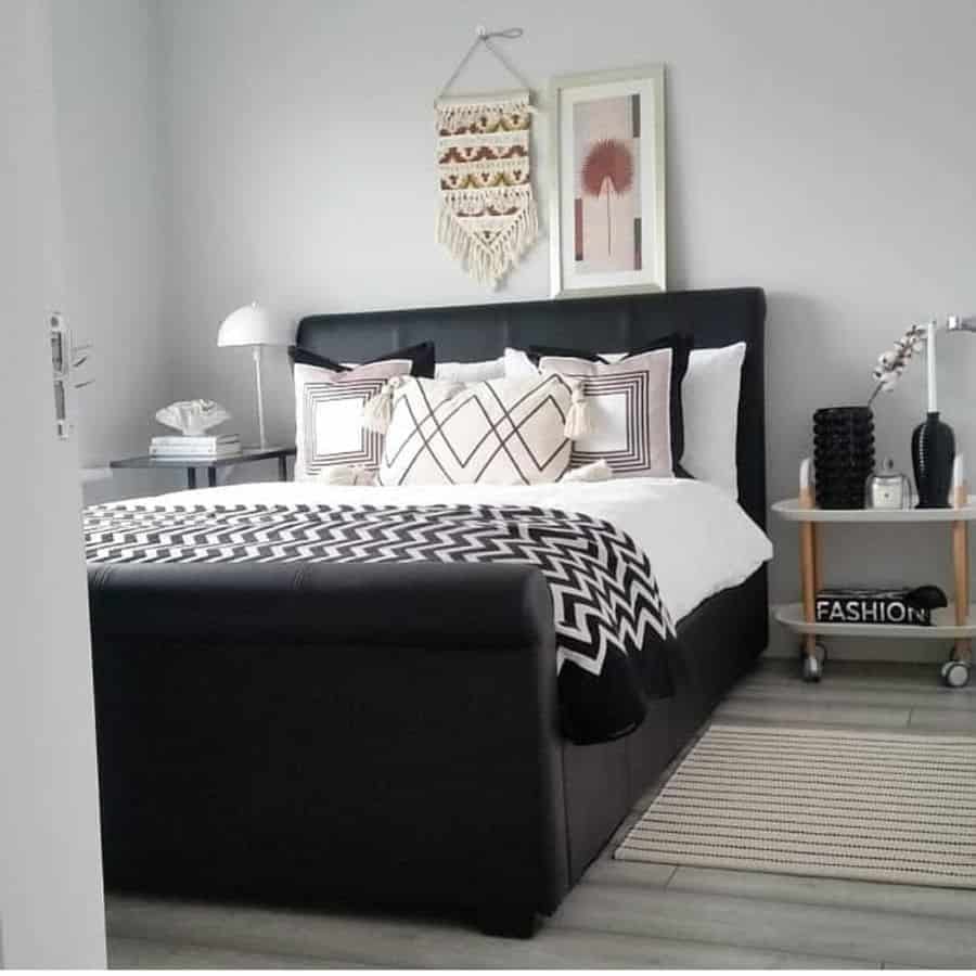 black frame bed in small gray modern bedroom