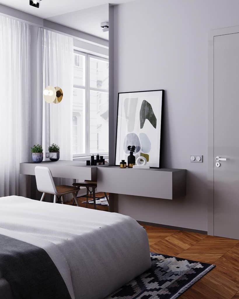 gray bedroom with vanity and large wall mirror