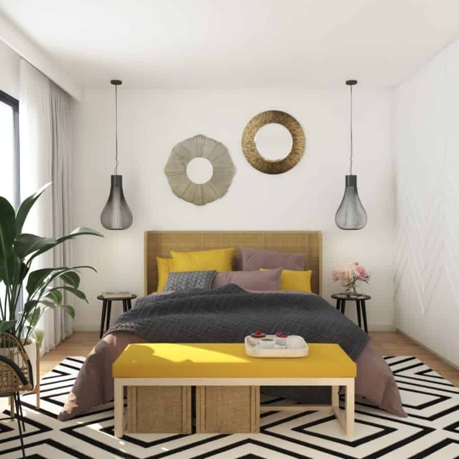 small modern bedroom with yellow ottoman