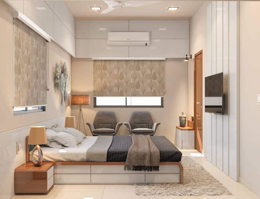 modern small bedroom with platform bed and gray accent chairs