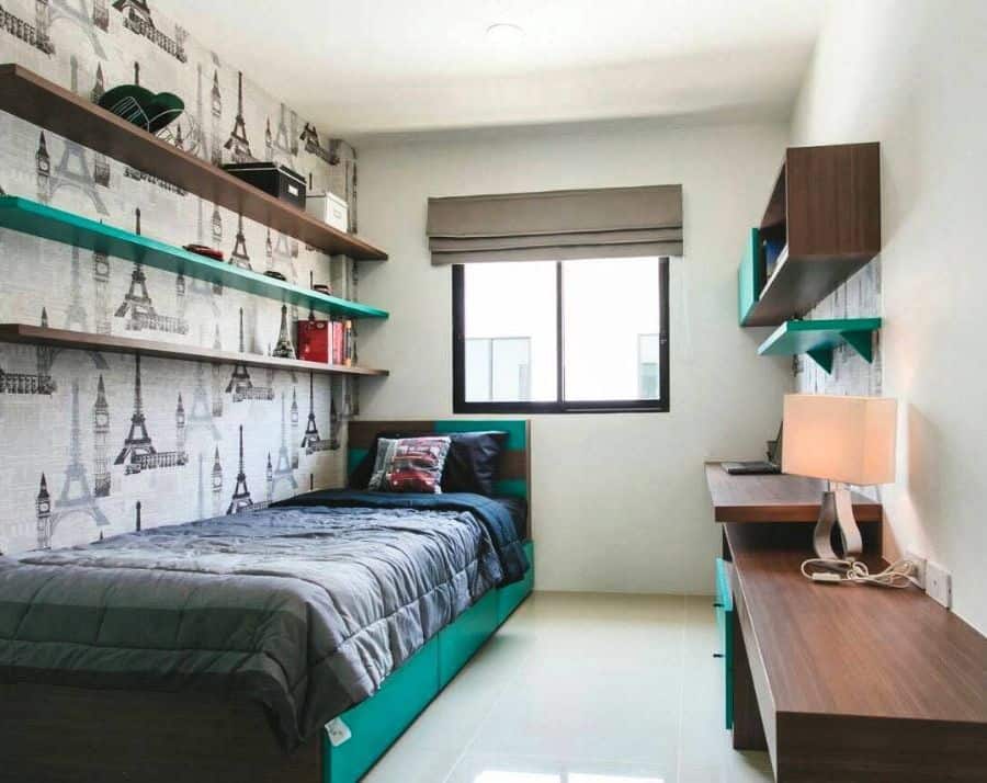 small single bedroom with eiffel tower wallpaper
