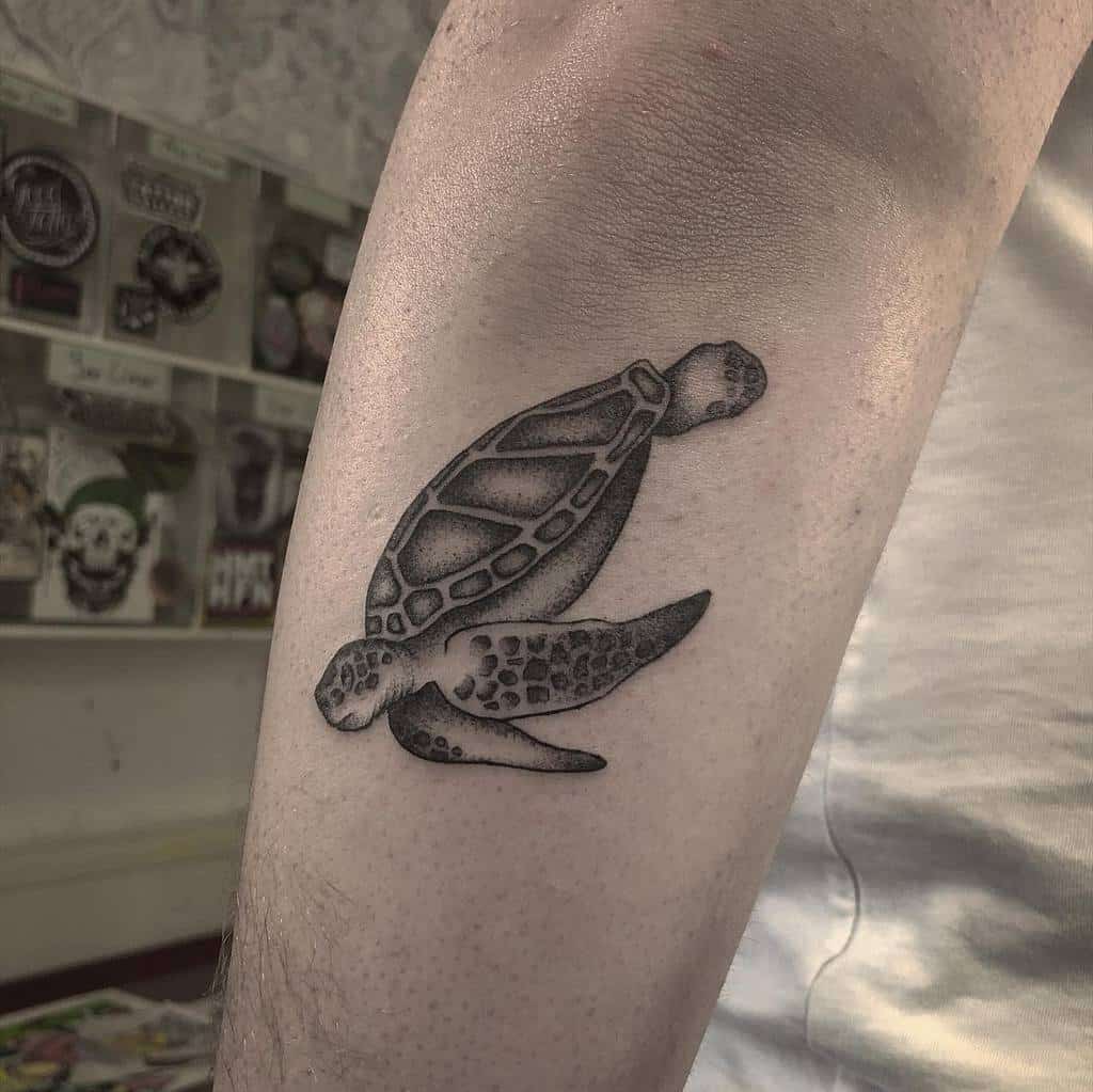 Tattoo of a sea turtle on a forearm