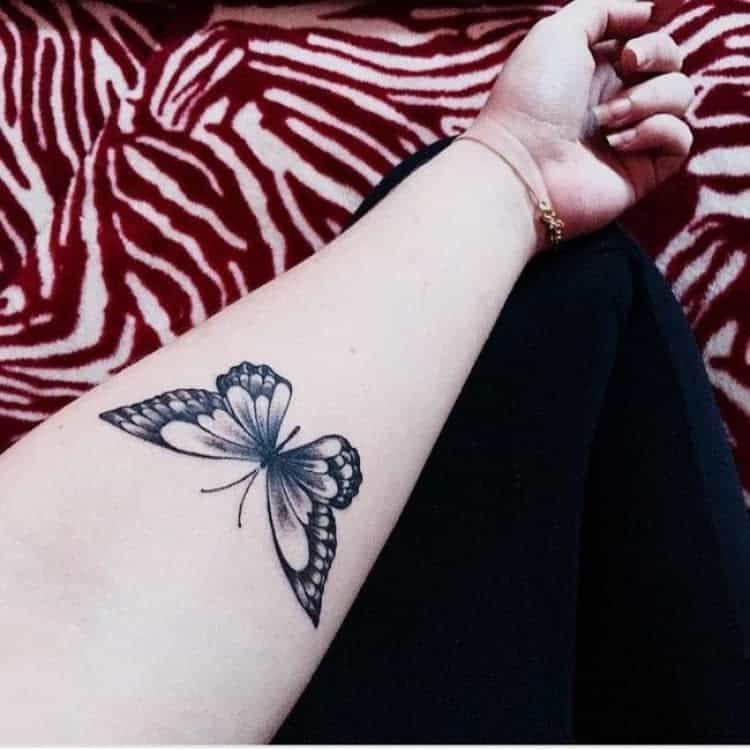 A captivating butterfly tattoo on a forearm