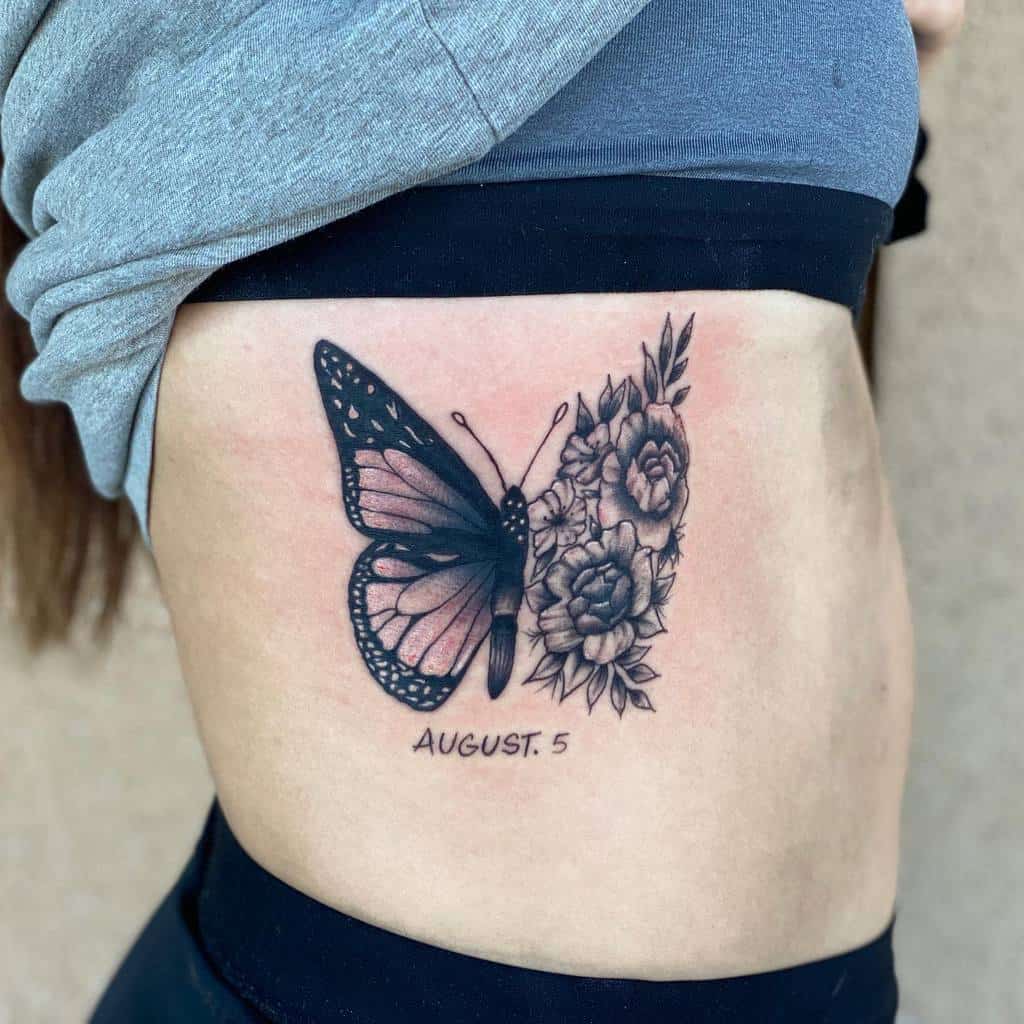 A delicate butterfly and floral tattoo graces a person's side, with "August 5" elegantly scripted beneath it