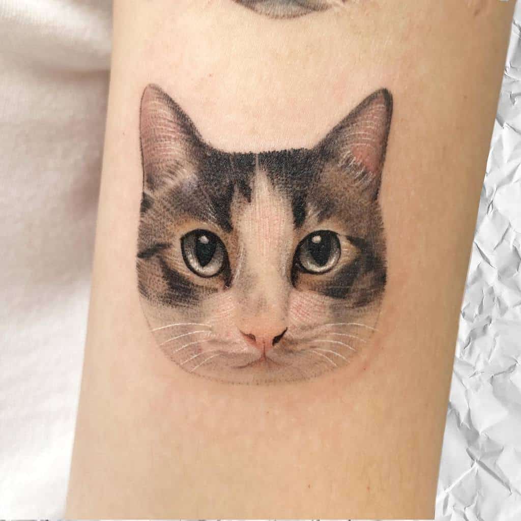 Realistic tattoo of a cat's face