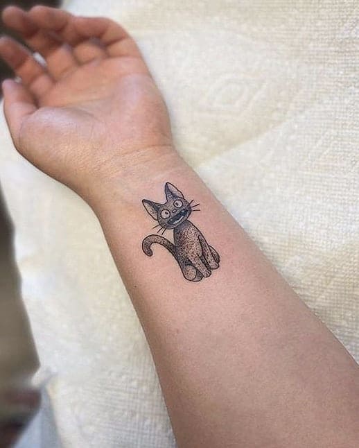 A cute cat tattoo on a wrist