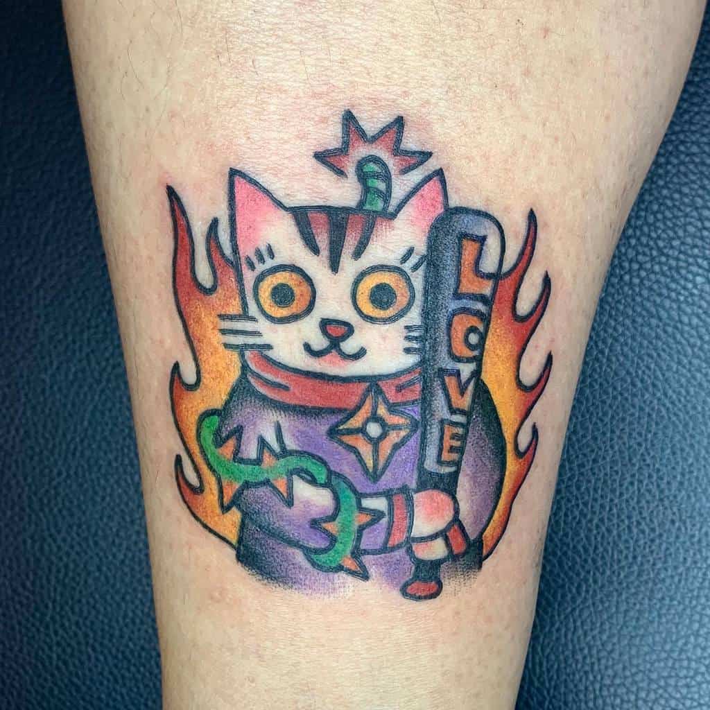 Tattoo of a cartoon cat in front of flames, holding a green snake and a staff with "LOVE"