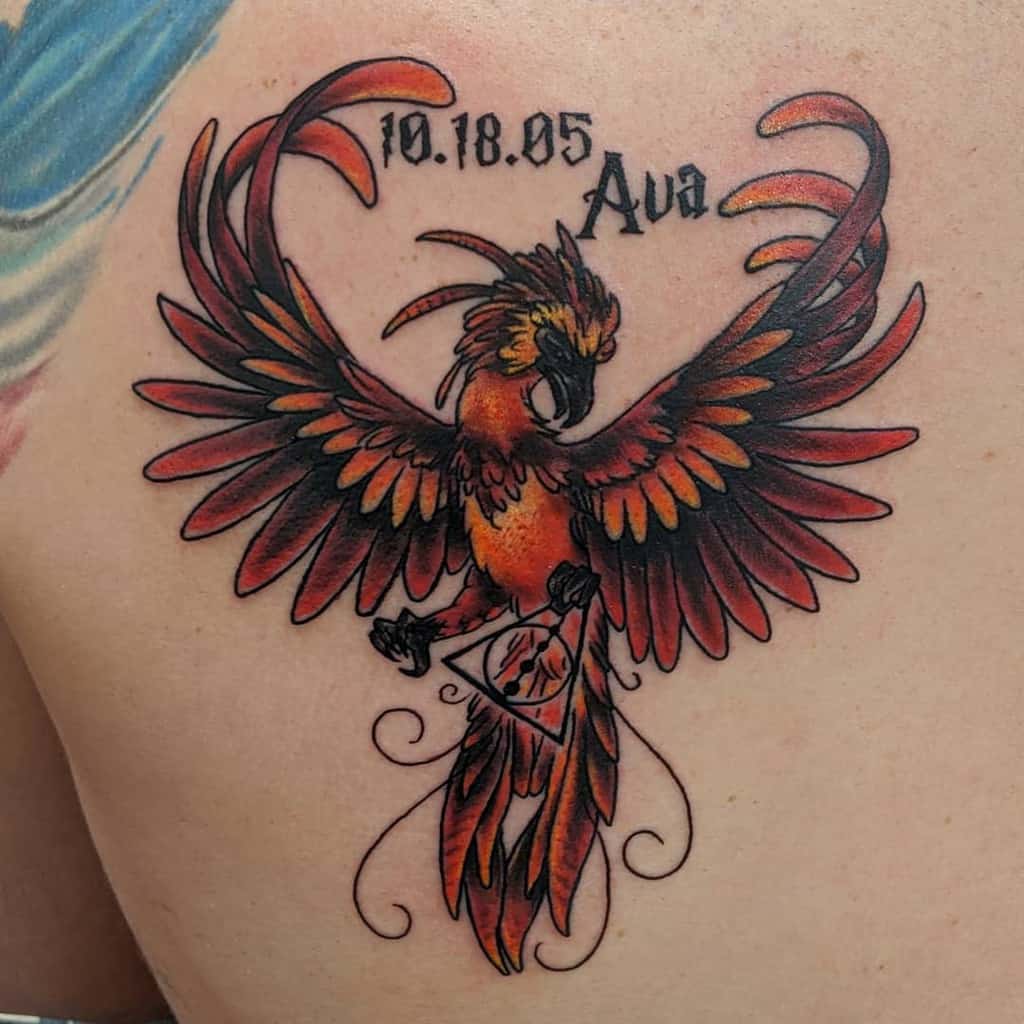 Phoenix tattoo with date "10.18.05" and the name "Ava"