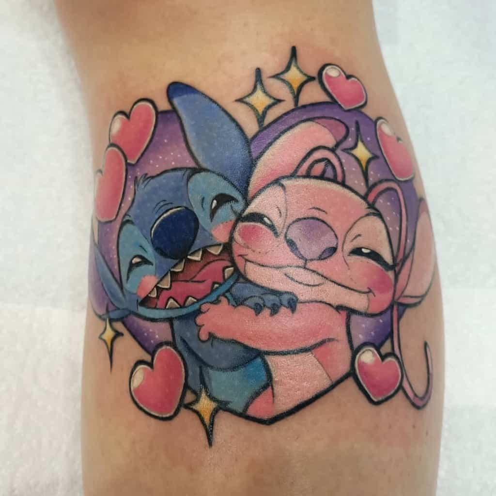 A colorful and heartwarming tattoo of Stitch and Angel from Lilo & Stitch, hugging each other with sparkling hearts surrounding them