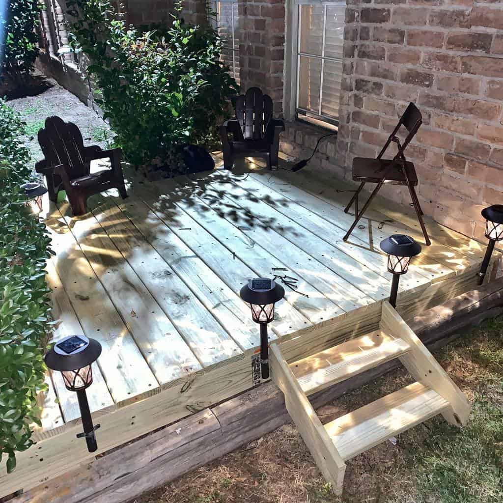 small wood deck brick wall lights