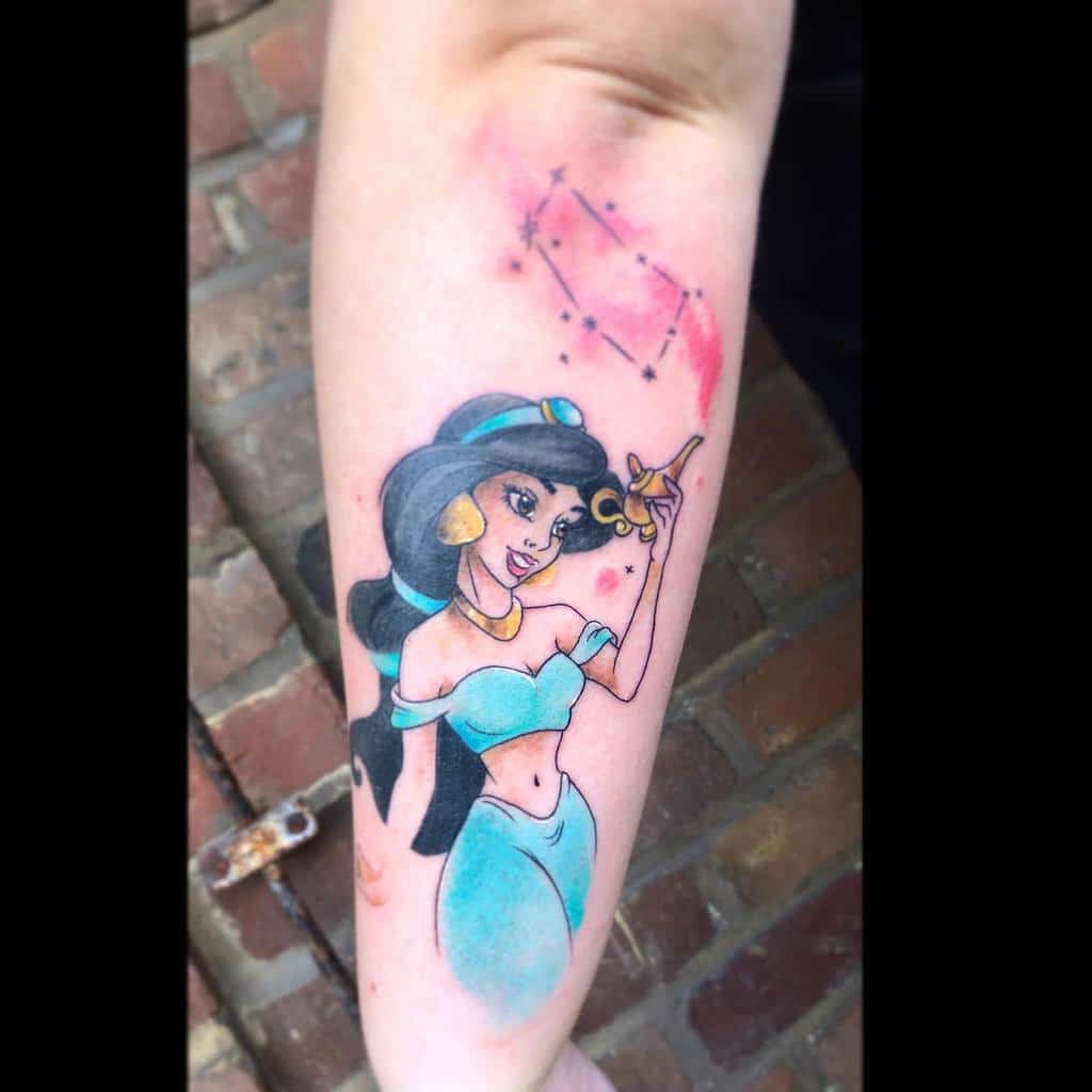 This tattoo showcases Princess Jasmine from Aladdin, accompanied by a constellation design, symbolizing her dreams and aspirations
