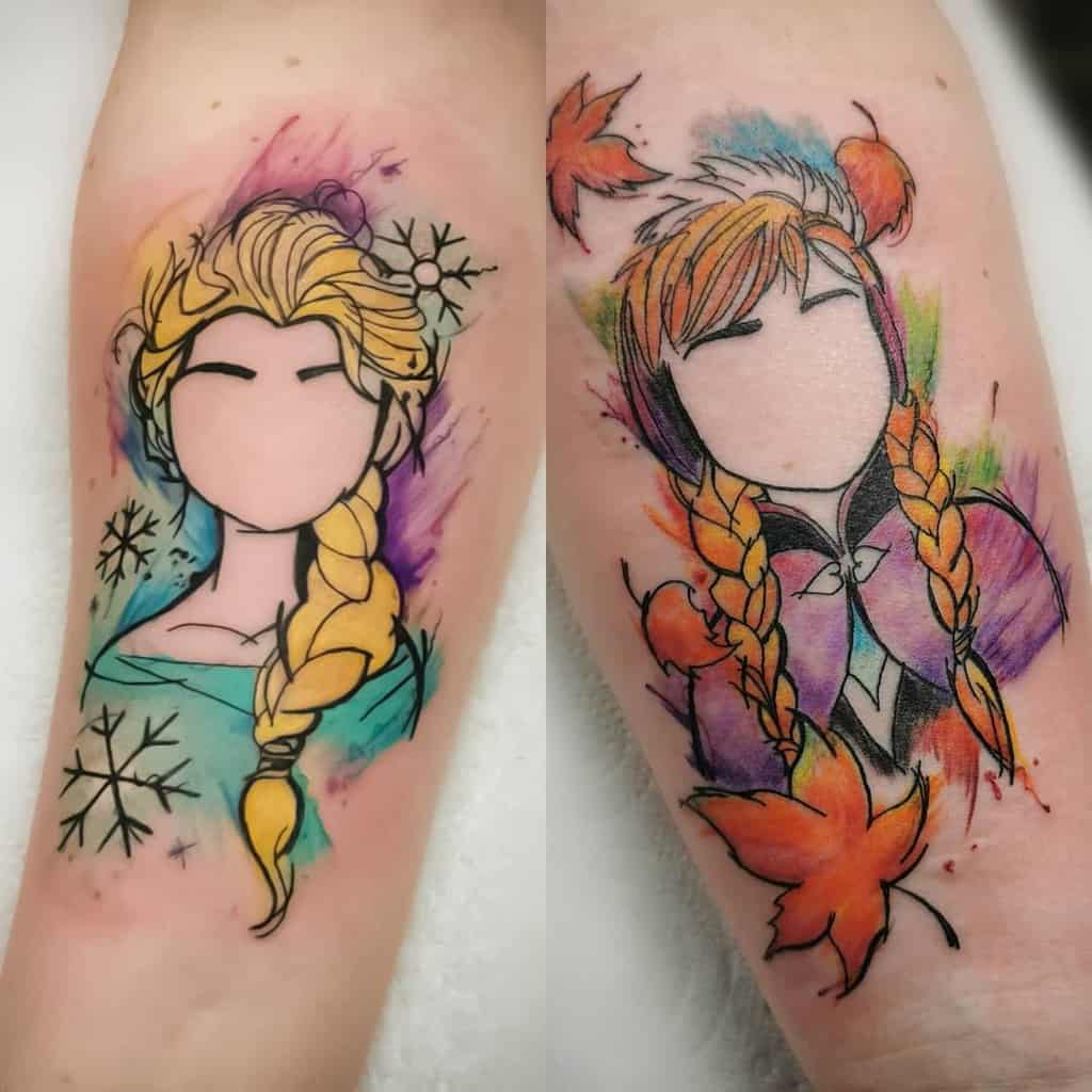 A dynamic duo of Elsa and Anna tattoos, captured in watercolor bursts, showcasing their iconic braids and outfits
