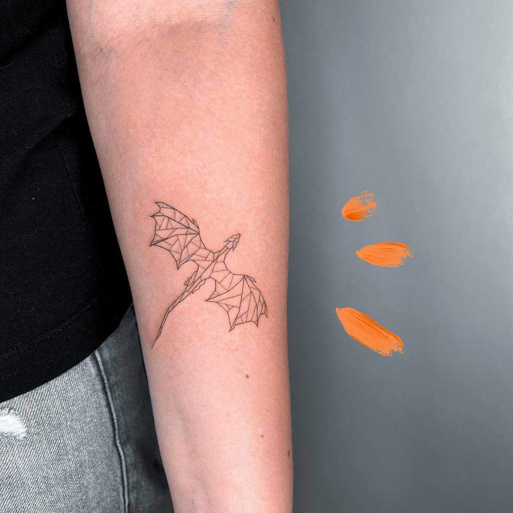 Line art dragon tattoo on forearm