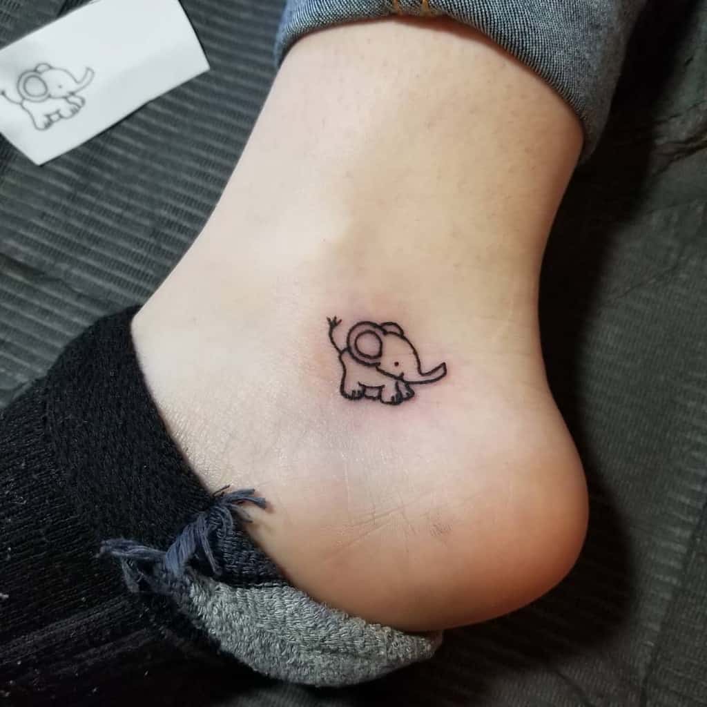 Simple elephant outline tattoo on ankle