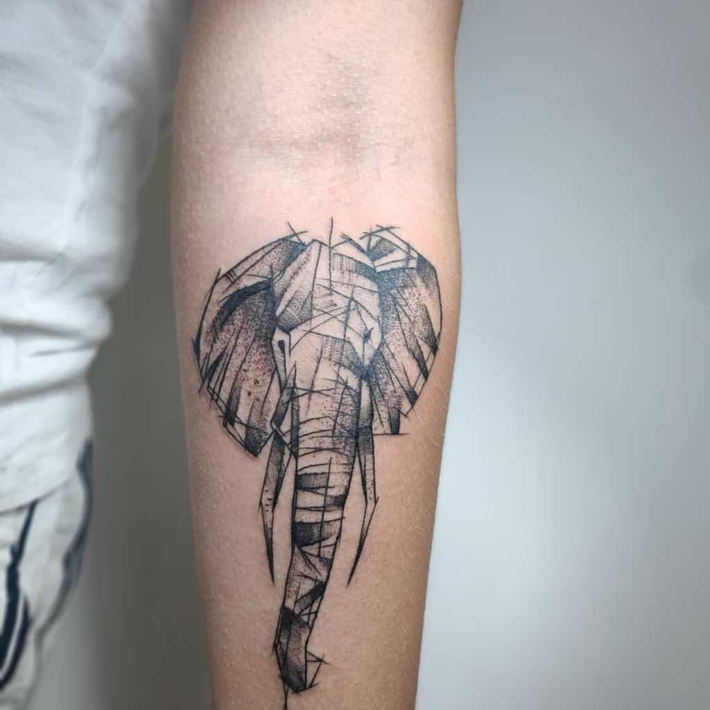 Geometric elephant tattoo on a forearm