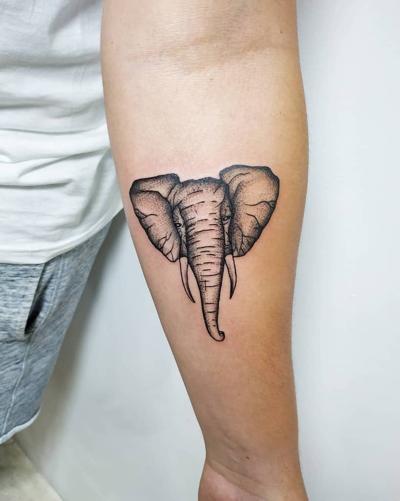 Elephant head tattoo on a person's forearm with detailed shading
