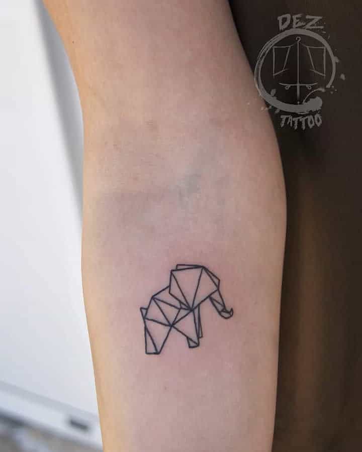 Minimalist geometric elephant tattoo on forearm