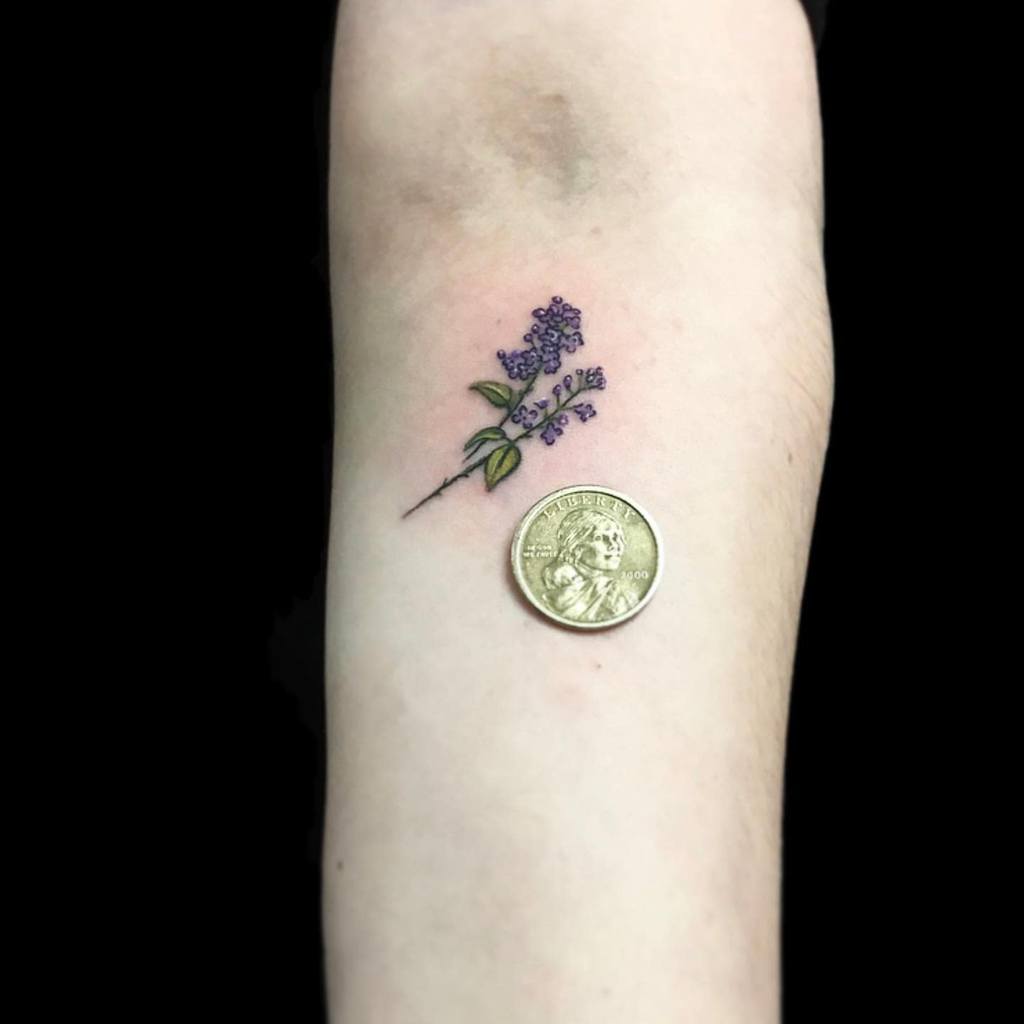 Minimalist lavender tattoo on forearm 