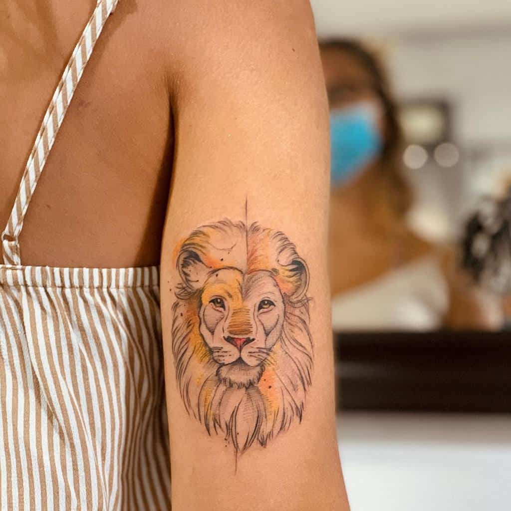 A majestic lion tattoo adorns the woman's upper arm
