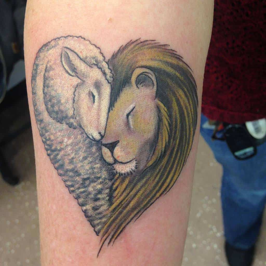 Tattoo of a lion and lamb with their heads together, forming a heart shape