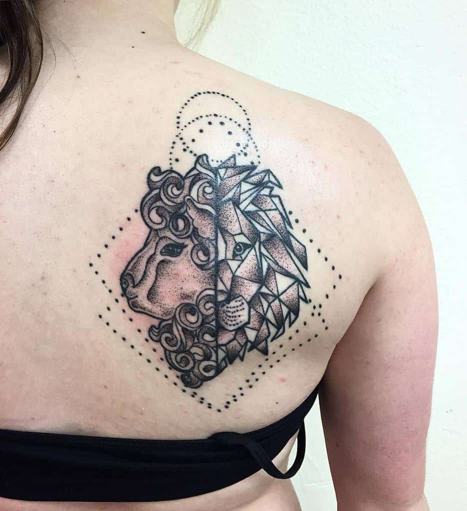 Geometric lion tattoo design on the back of a person, with a curly mane on one side and angular shapes, embodies both the lion’s fierce strength and the gentle spirit of a lamb