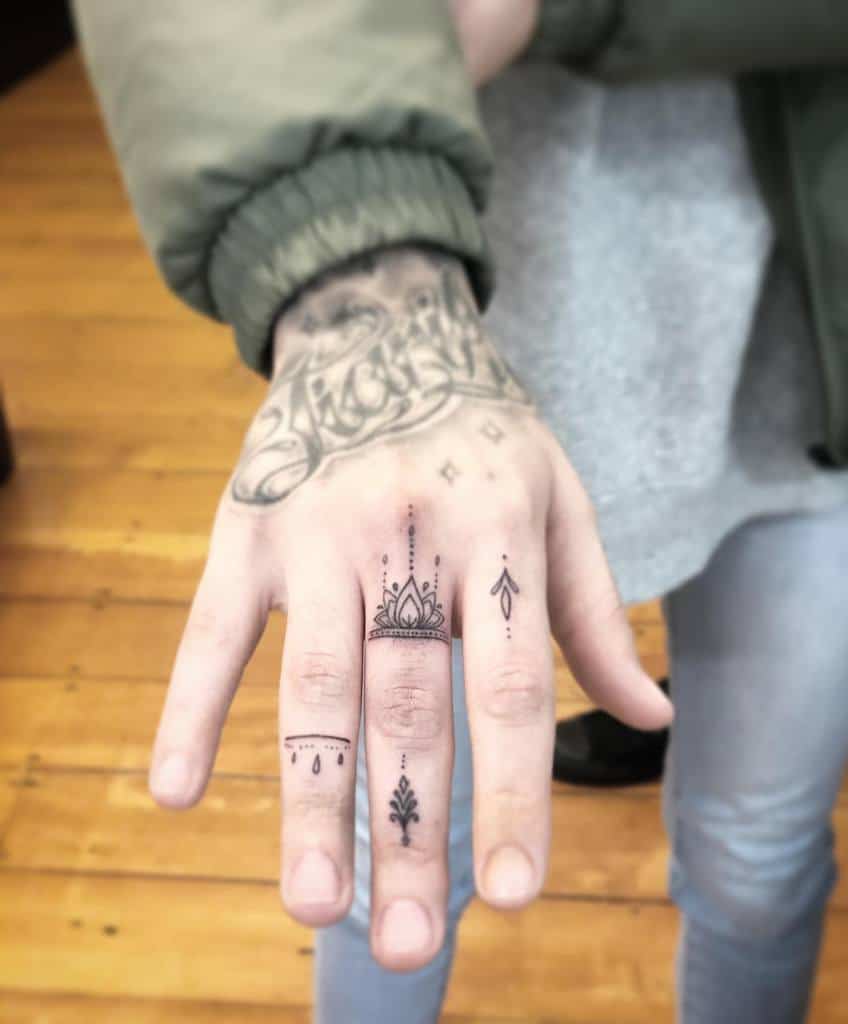 Small Mandala Ornament Finger Tattoos janetattoo_nz