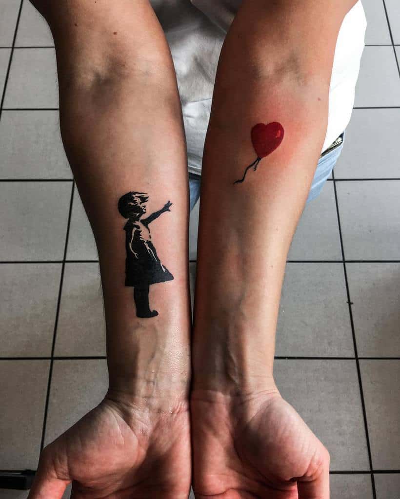 Two forearm tattoos: a girl reaching for a red heart-shaped balloon