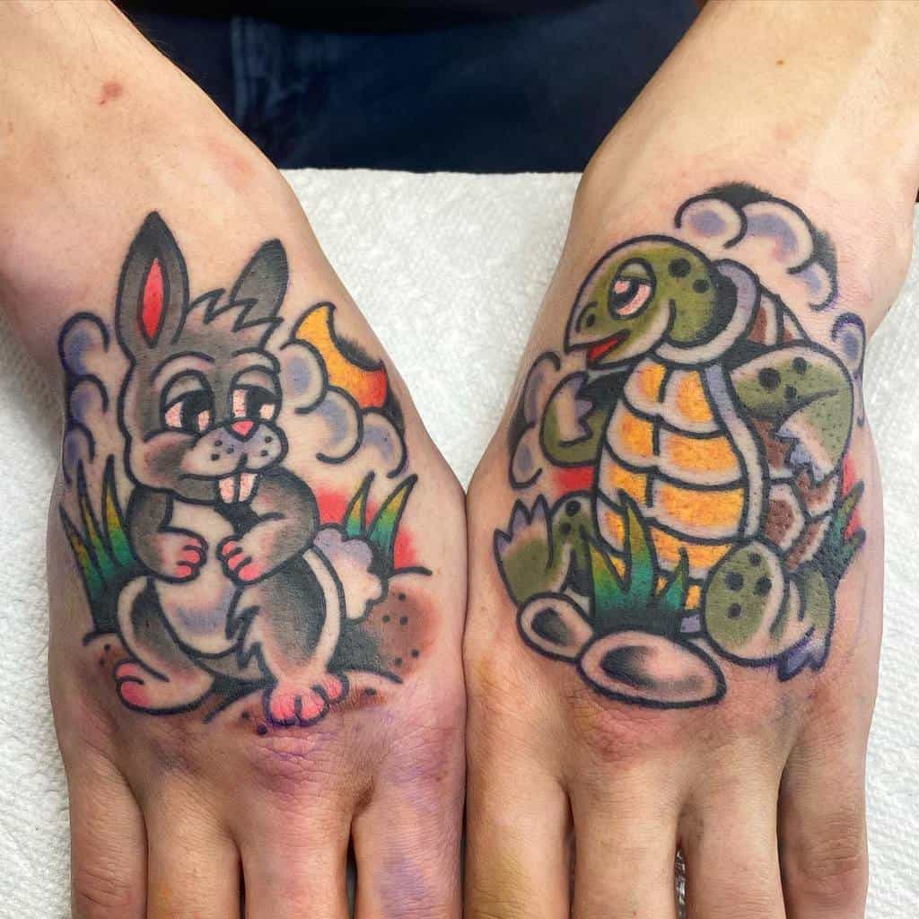 Hands with colorful tattoos of a playful rabbit and a smiling turtle