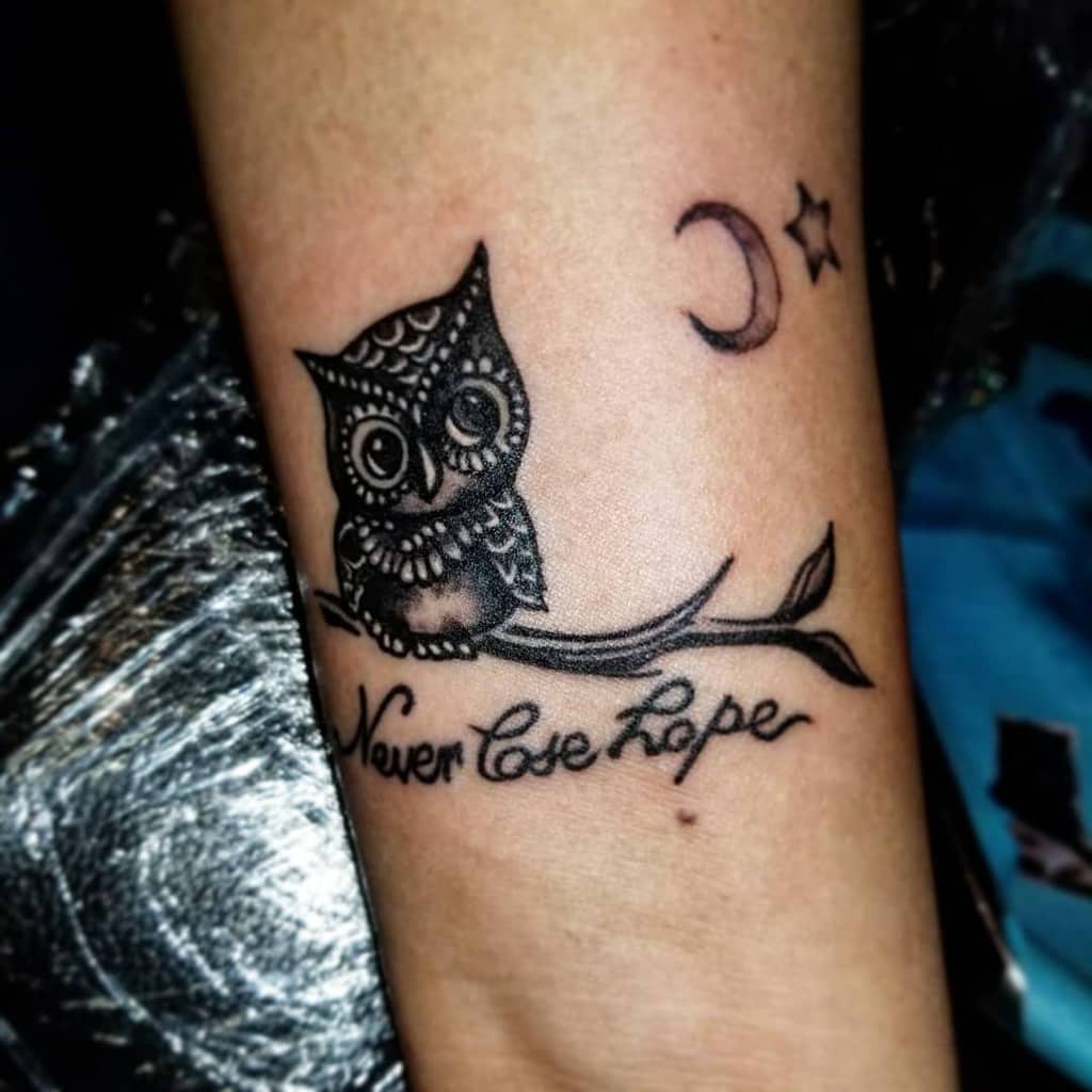 An owl perched on a branch with "Never lose hope" elegantly scripted beneath, accompanied by a serene crescent moon and twinkling star
