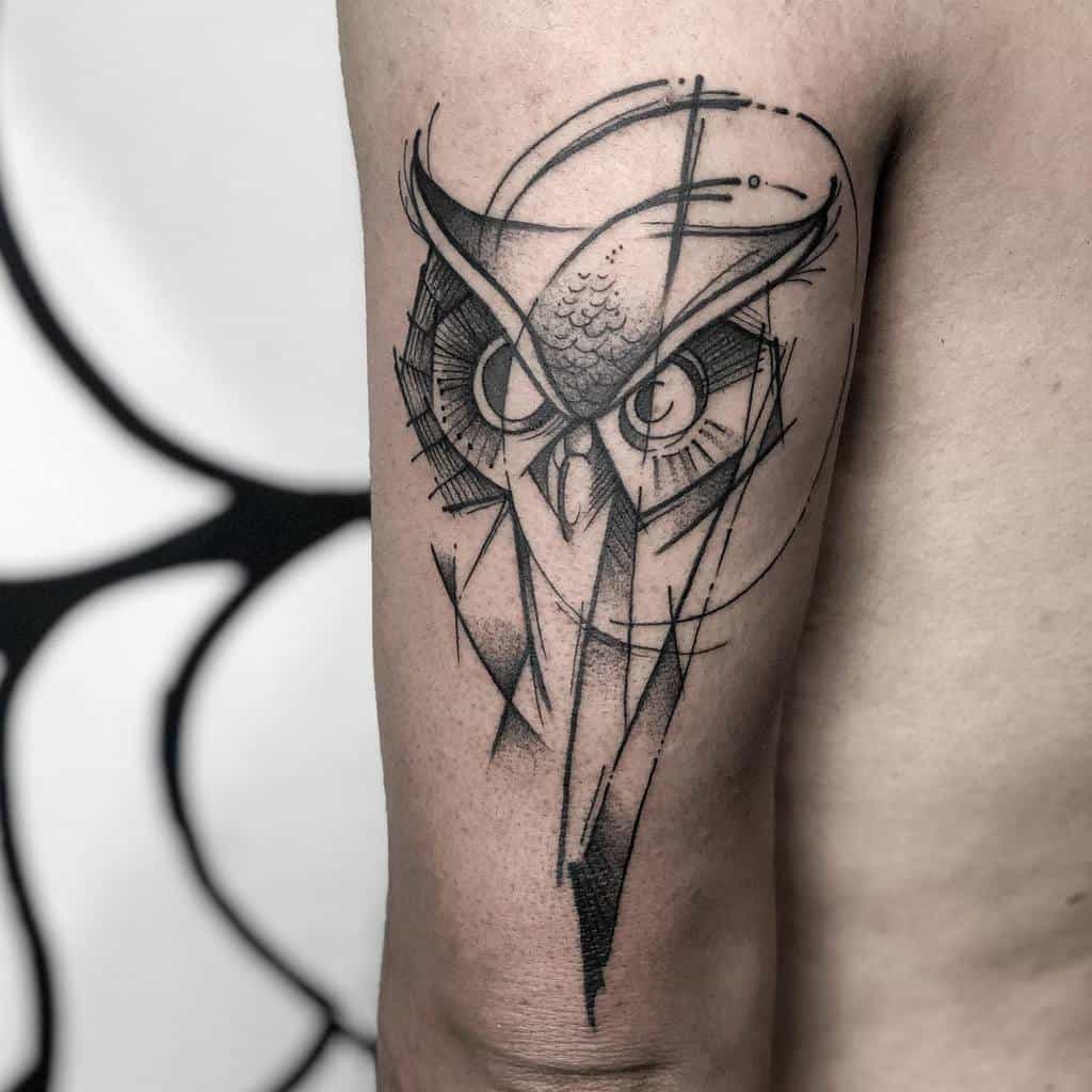 A stylized geometric owl tattoo elegantly adorns the upper arm, capturing attention with its intricate design