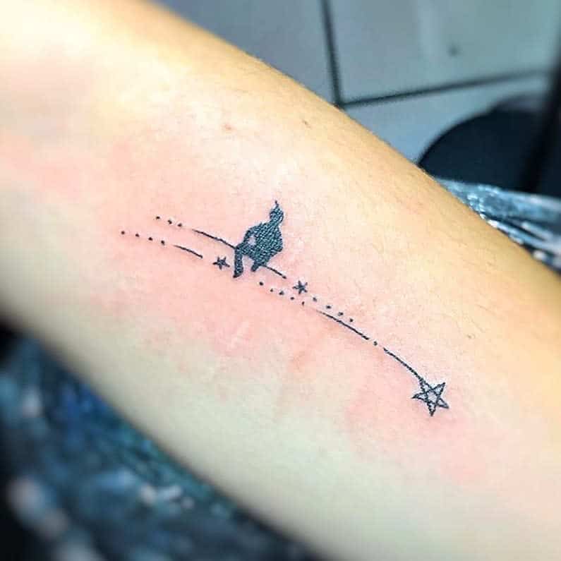 Minimalist Peter Pan tattoo with a dotted flight path leading to a star, symbolizing dreams and adventure